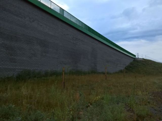 Reinforced soil retaining wall with block facing.jpg